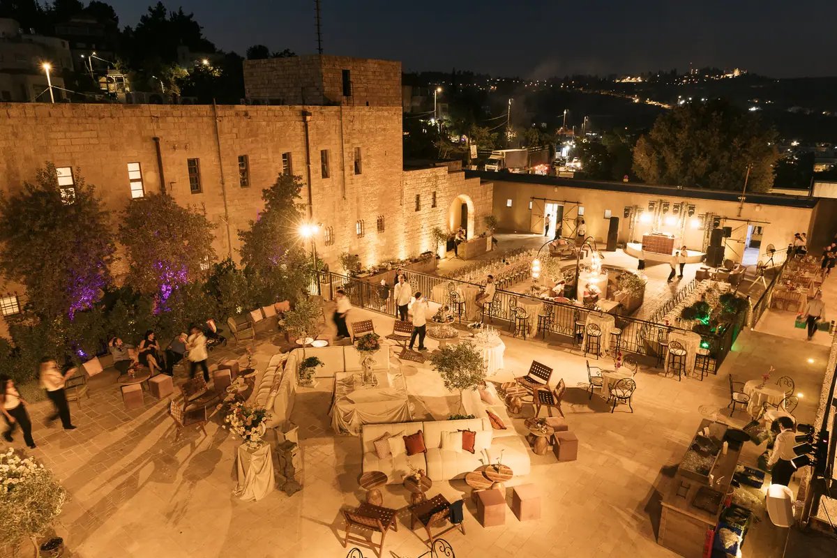 The courtyard from above at night, full of guests